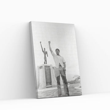 Muhammad Ali Posing In Front Of The Le Militant Statue, Kinshasa, Zaire Canvas Wall Art - Y Canvas