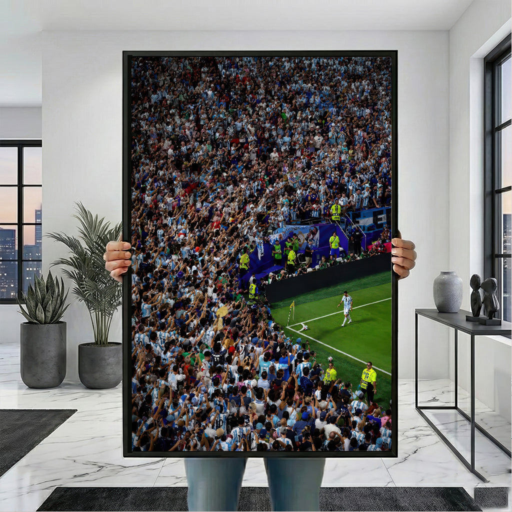 Messi Stadium Legend canvas wall art with black frame, shown held for scale