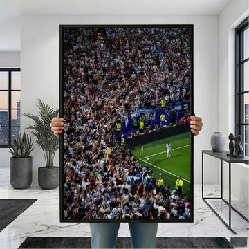 Messi Stadium Legend canvas wall art with black frame, shown held for scale