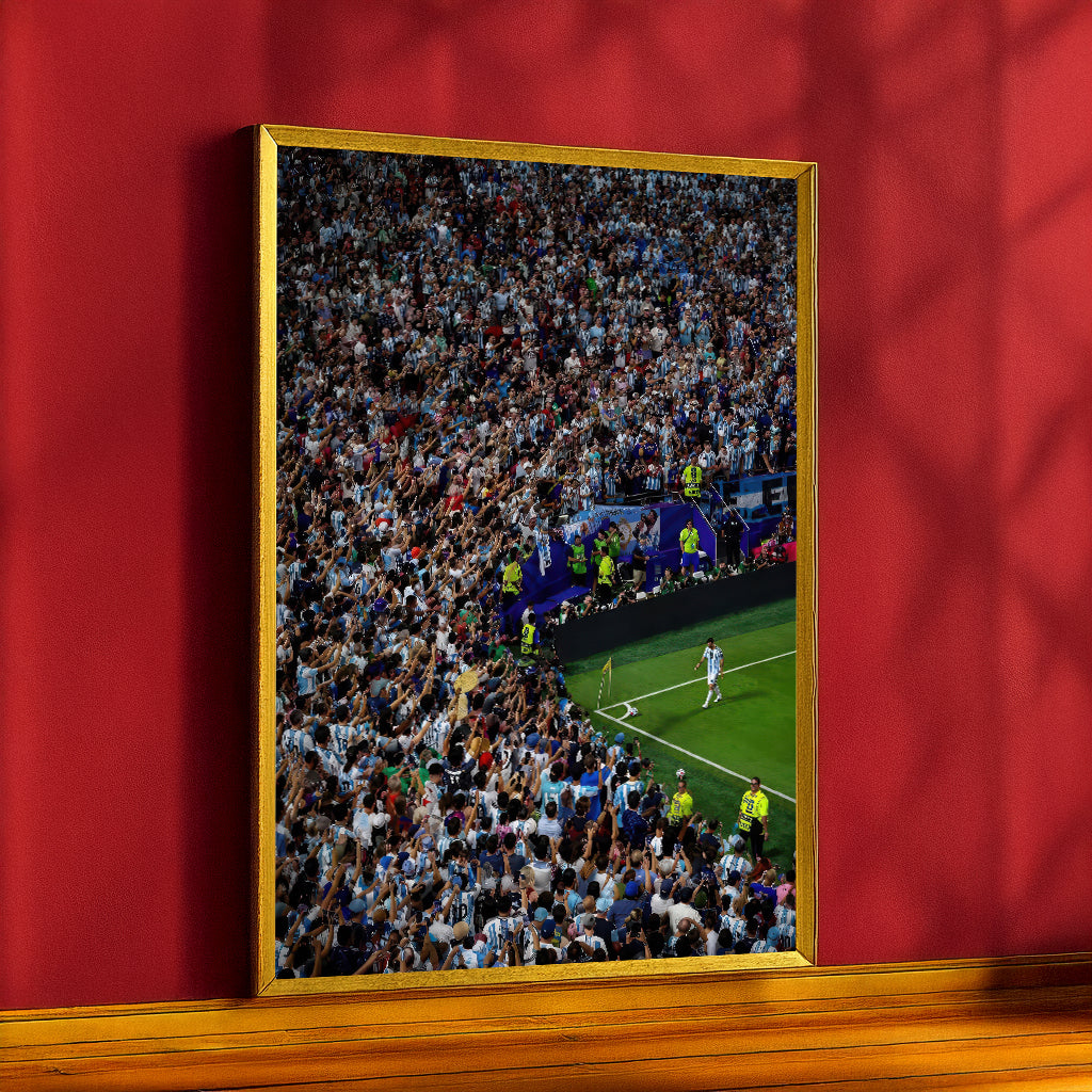 Messi Stadium Legend canvas in a gold frame against a red wall