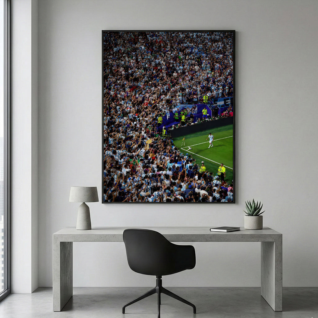 Messi Stadium Legend black framed canvas above a modern desk