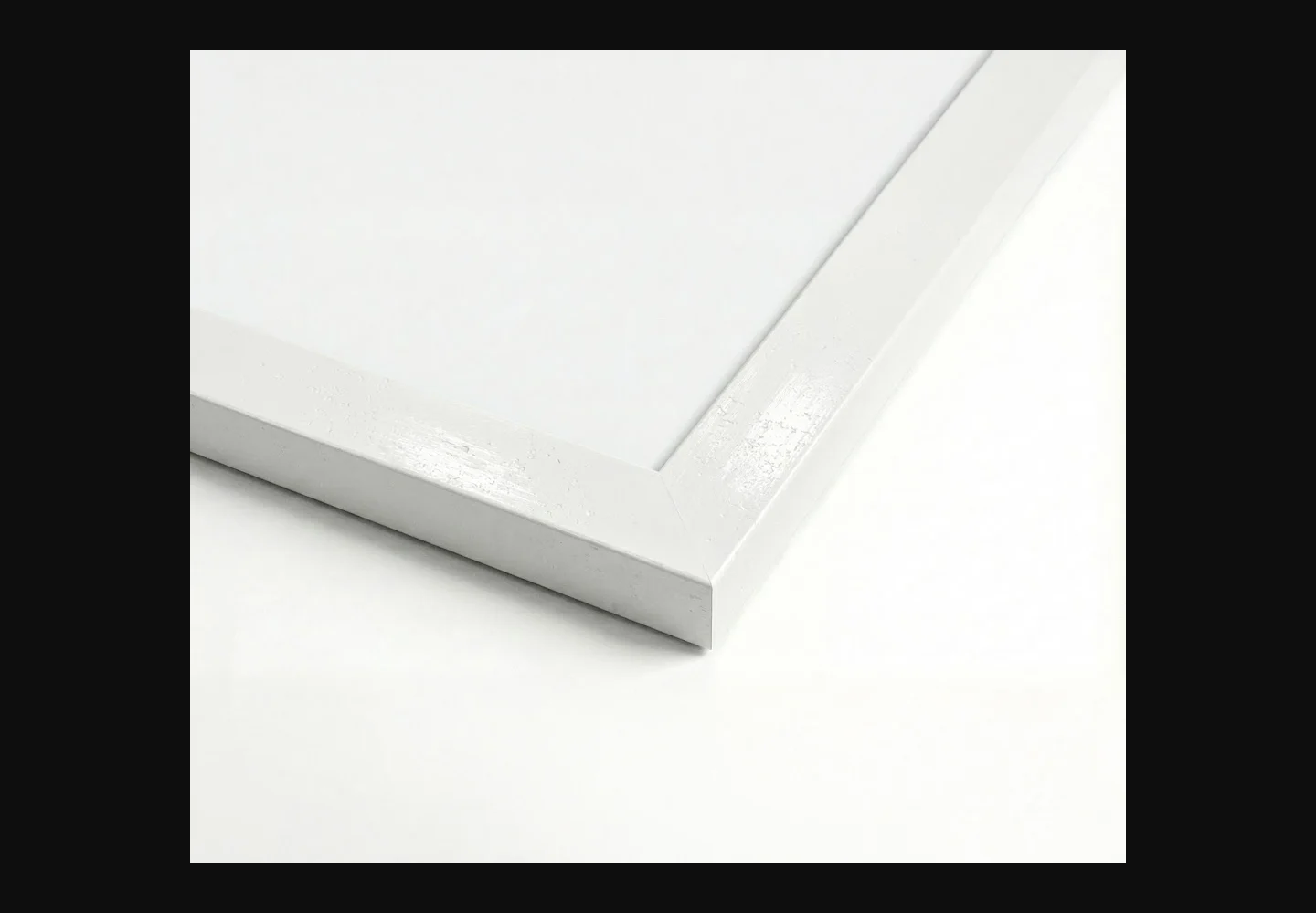 Close-up of the white canvas frame and its corner finish
